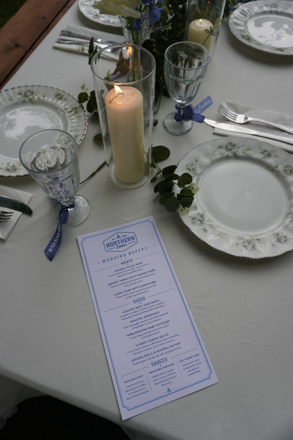 A Northern Ember wedding buffet menu card on a set table